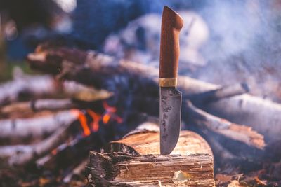 Close-up of knife on wood