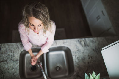 Girl looking away while sitting at home