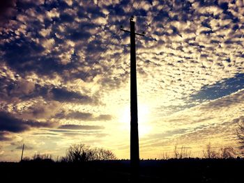 Low angle view of cloudy sky at sunset