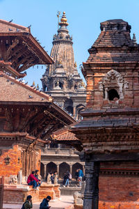 Group of people in front of historic building