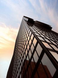 Low angle view of building against cloudy sky