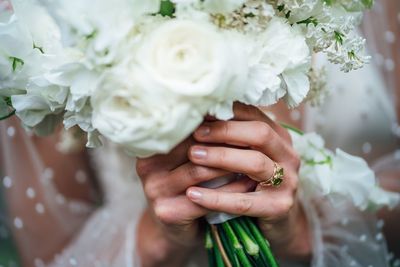 Close-up of hand holding bouquet