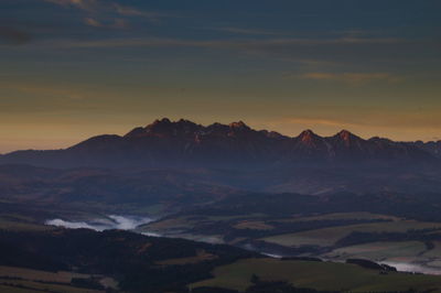 Scenic view of mountains against sky during sunset