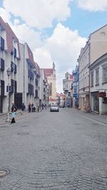 Street in city against sky