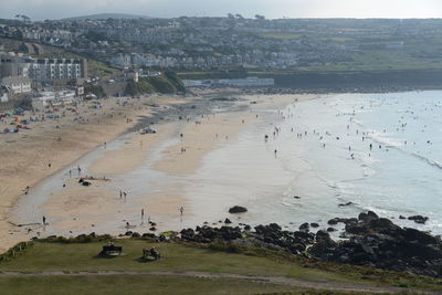 High angle view of buildings by sea