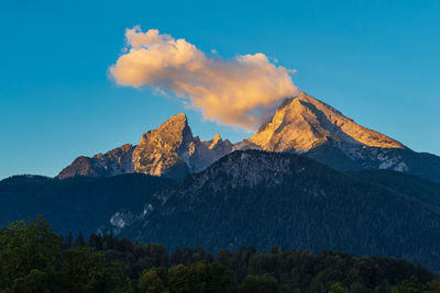 Scenic view of mountains against clear blue sky