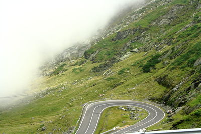 Aerial view of mountain road against sky
