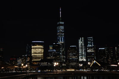 Illuminated buildings in city at night