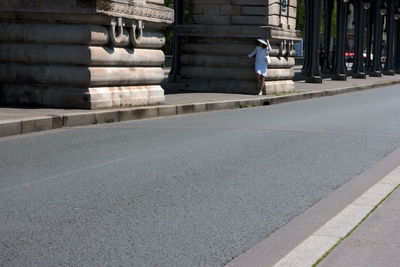 Man in front of building