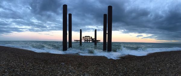 Scenic view of sea against cloudy sky