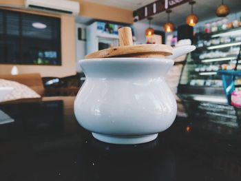 Coffee pot on table at restaurant