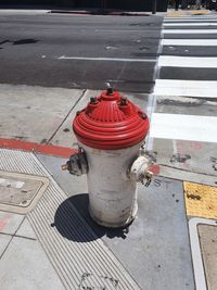 High angle view of fire hydrant on footpath