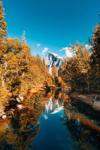 Scenic view of lake against sky during autumn