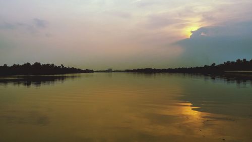 Scenic view of lake against sky during sunset