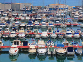 High angle view of boats moored at harbor