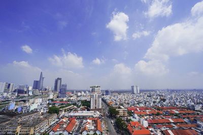 High angle view of modern buildings in city against sky