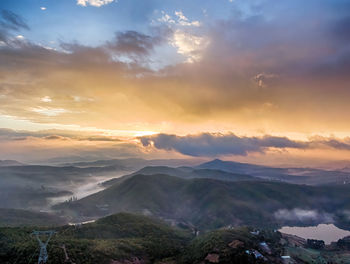 Scenic view of mountains against sky during sunset