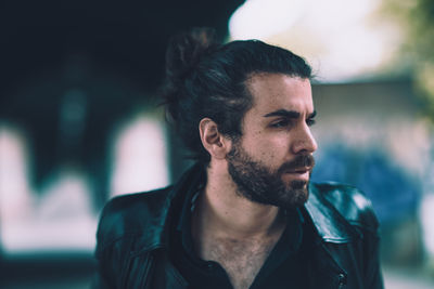 Portrait of young man looking away