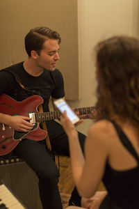 Young musicians practicing at a rehearsal space