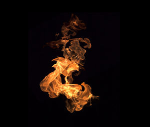 Close-up of fire against black background