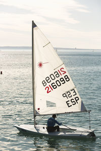 Sailboat on sea against sky