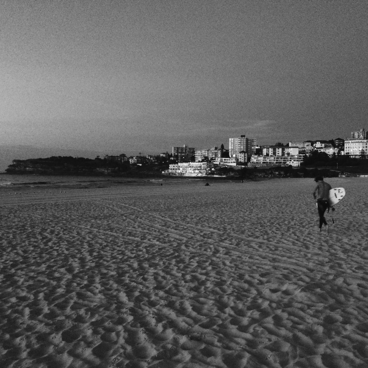 beach, sand, sea, building exterior, built structure, architecture, shore, water, city, sky, leisure activity, incidental people, lifestyles, outdoors, day, nature, men, wave