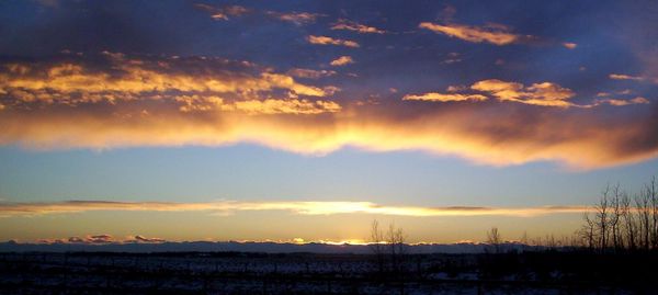 Scenic view of dramatic sky during sunset