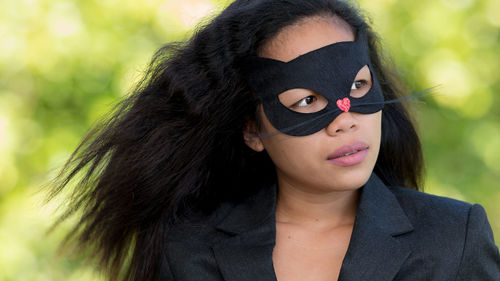Woman looking away while wearing mask