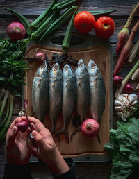 Midsection of man holding fruits