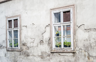 The old dilapidated wooden window frame.