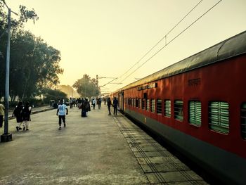 Train at railroad station against clear sky