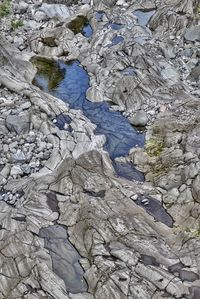 High angle view of rocks in water