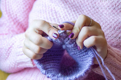 Close-up of woman holding hands