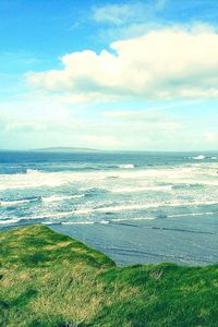 Scenic view of sea against cloudy sky