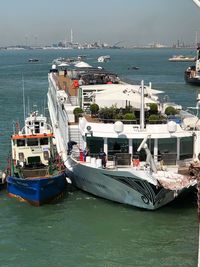 Boats moored at harbor