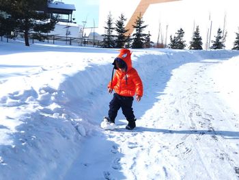 Full length of man on snow covered field