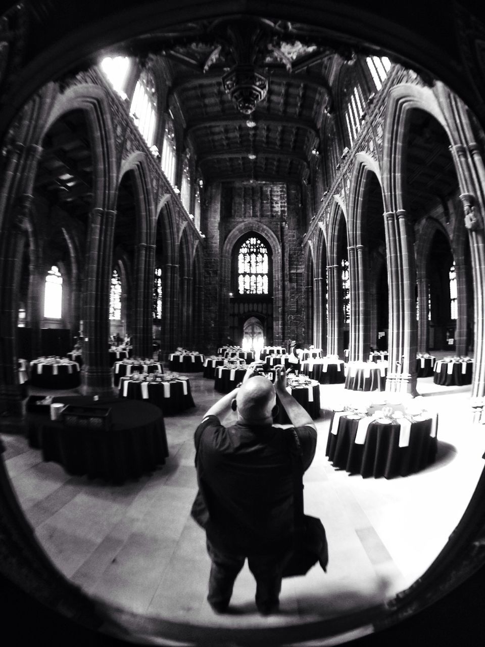 indoors, arch, lifestyles, leisure activity, men, sitting, rear view, place of worship, person, religion, full length, casual clothing, spirituality, church, standing, window