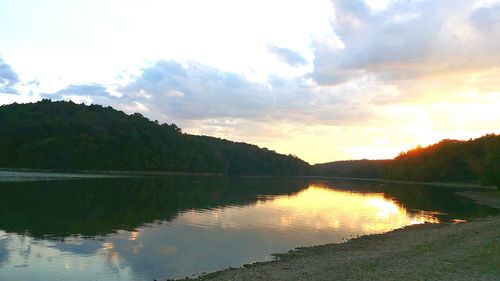 Scenic view of lake against sky during sunset