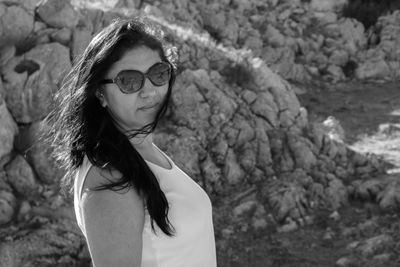 Portrait of young woman wearing sunglasses