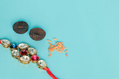 High angle view of candies on table against blue background