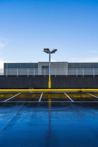 Built structure on field against clear blue sky