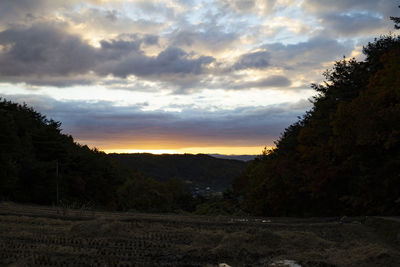 Scenic view of landscape against sky during sunset