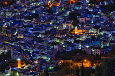 High angle view of city buildings at night