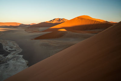 Wonderful orange sand dunes at sunset