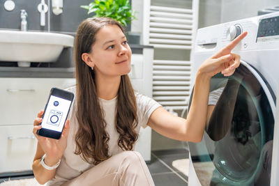 Young woman using mobile phone