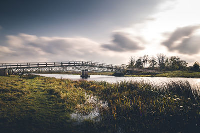 Bridge over river against sky