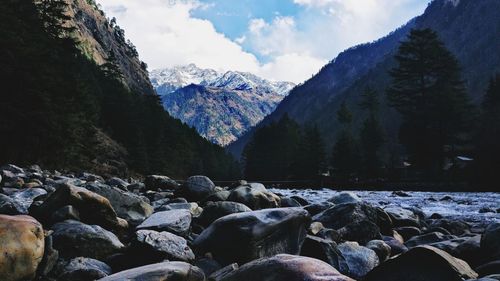 Scenic view of snow covered mountains against sky