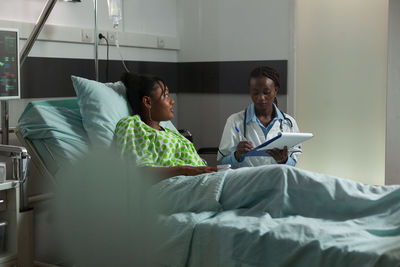 Female doctor examining patient