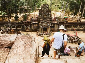 People standing outside temple