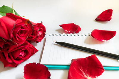 High angle view of red roses on table